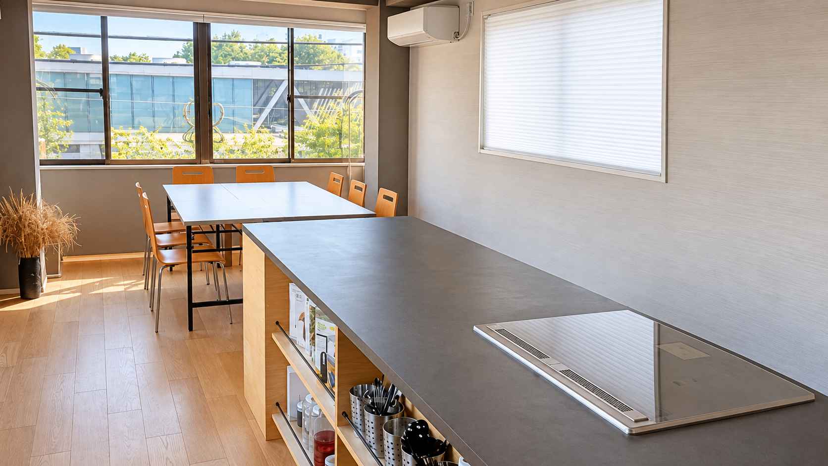 Interior of haccobo Studio with a central cooking counter and seating for small groups