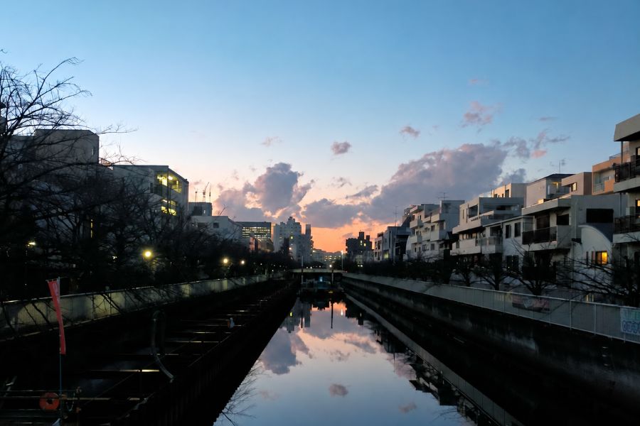 A canal running through the neighborhood at dusk