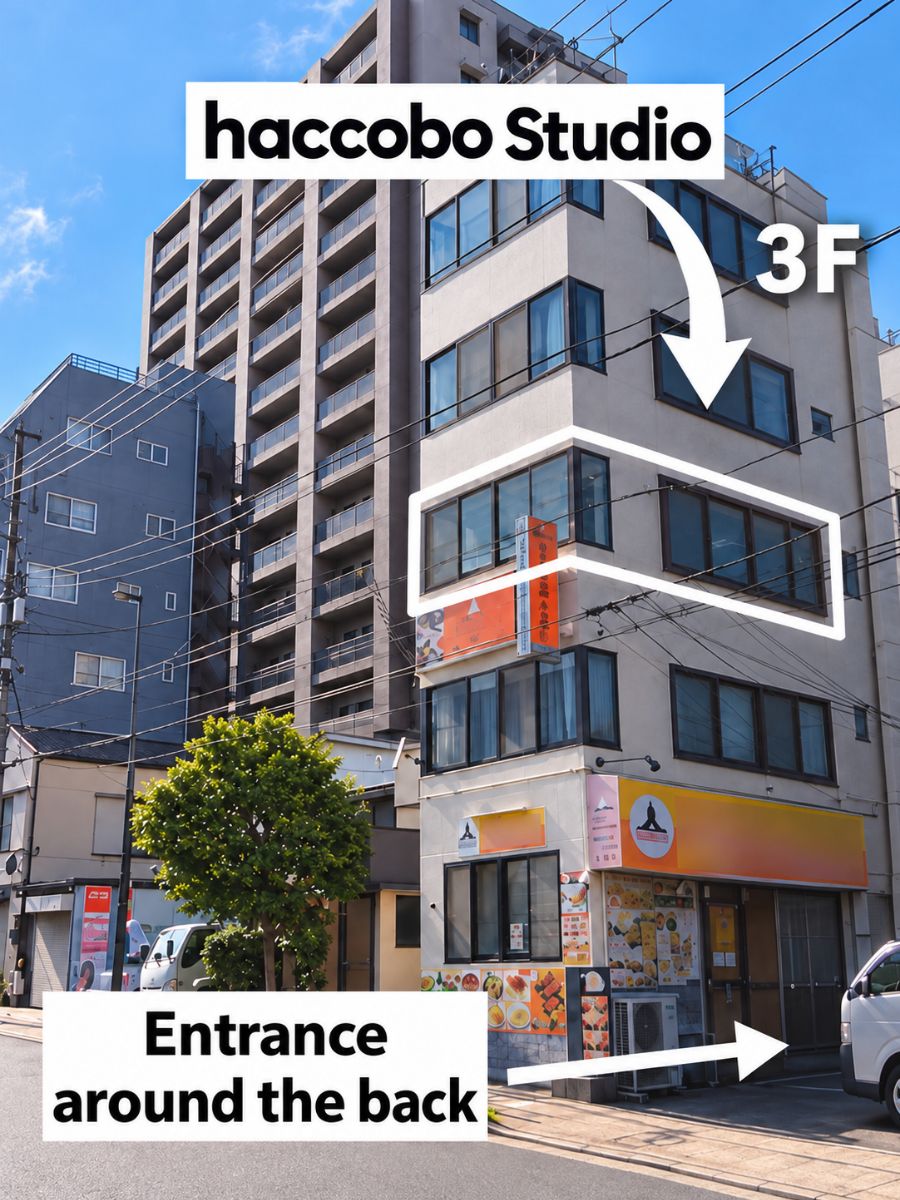 haccobo Studio building exterior with an arrow pointing to the 3rd floor and a sign reading Entrance around the back