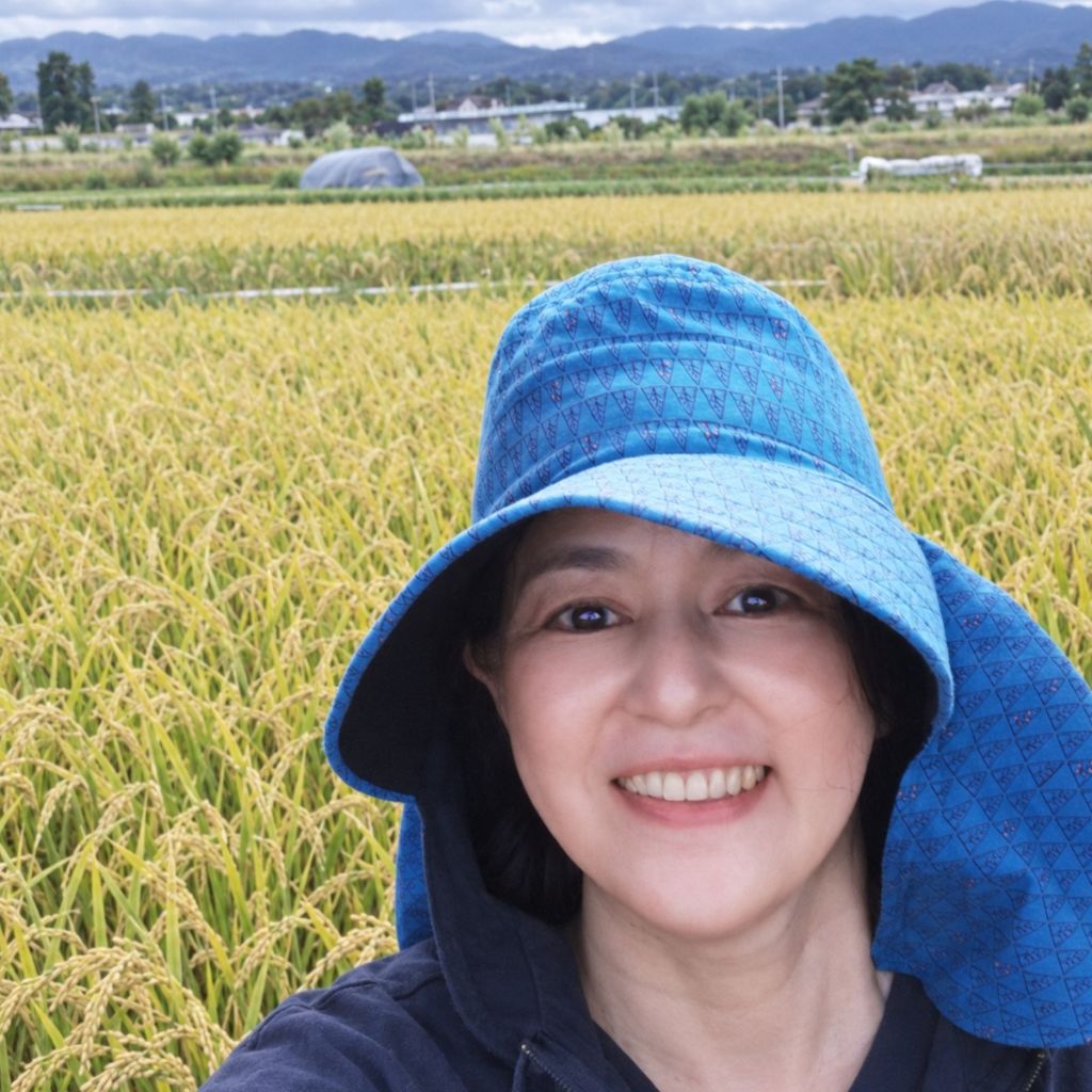 Midori working in a rice field